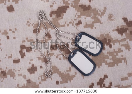 us army camouflaged uniform with blank dog tags