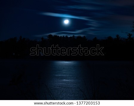 Moon Reflecting over Frozen Lake