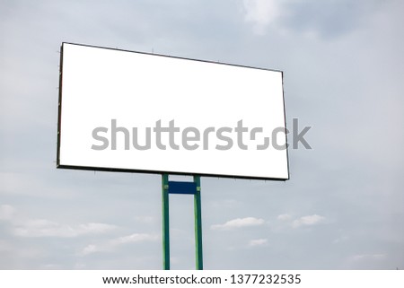 Empty billboard blank for advertising, on background of cloudy sky.