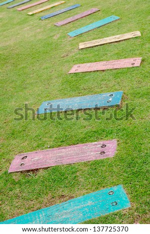 wood plate line walk path on grass field garden