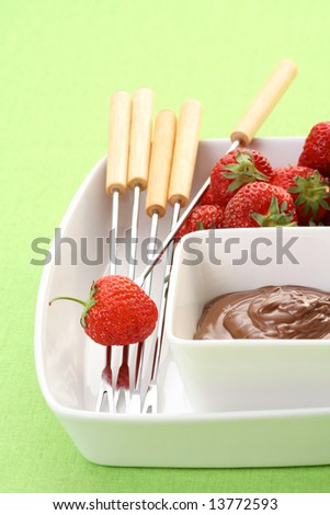 bowl of hot chocolate and fresh strawberries