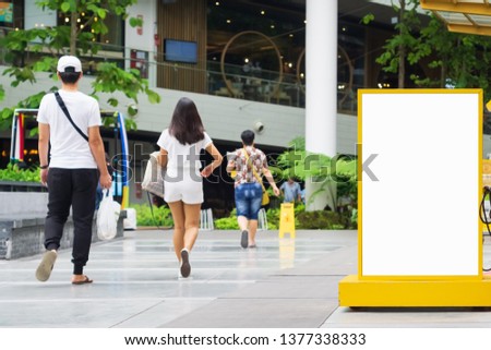 Clear empty billboard mock up with copy space for advertising text message or content, public information board in urban shopping area scene, promotional sale mock up.