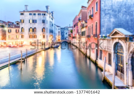 Defocused background of picturesque canal with beautiful reflections in Castello district of Venice, Italy. Intentionally blurred post production for bokeh effect