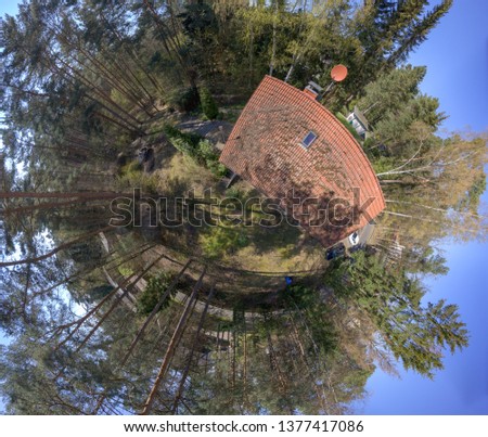 Circular panorama from composite aerial photos of a small typical German detached house on a forest plot, deliberately distorted, Germany