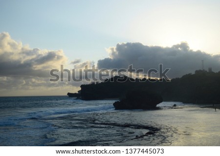 The View of the Cliff Silhouette Jutting into the Sea 