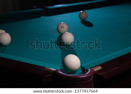Balls for Russian billiards are on the table.