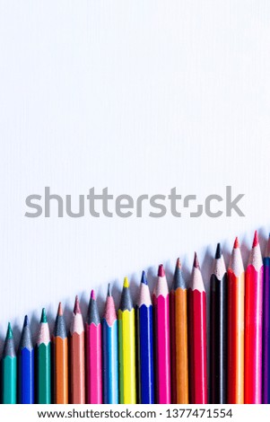 A row of Colorful Pencils showing an increasing graph