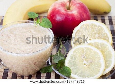  Cocktail of apple, banana and lemon in a cup.