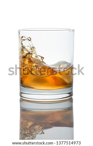 Glass of whisky, splash