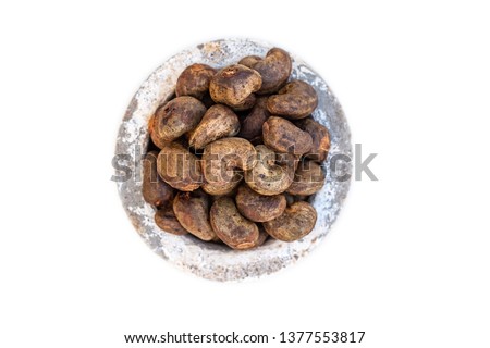 Cashew - bowl filled of raw nuts in the shell