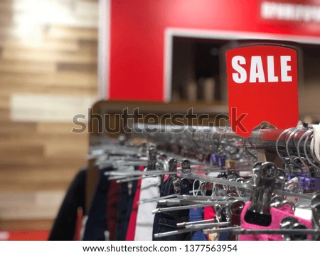Signboard with the inscription "Sale" in the fashion store.  - Image