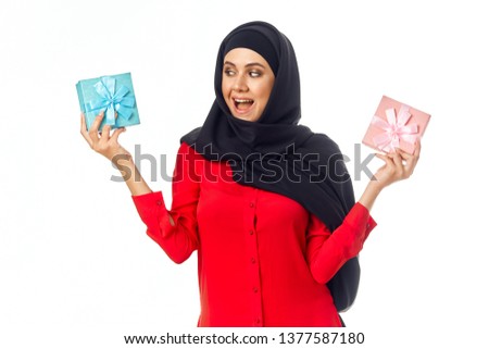  woman joyful hijab with gifts                              