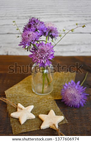 Bottle With Flowers on wood table