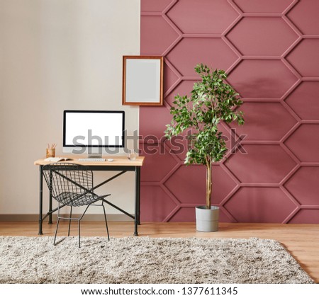Decorative living room with white and claret red wall background, grey sofa and middle table decoration, wooden working table and computer interior style. Royalty-Free Stock Photo #1377611345