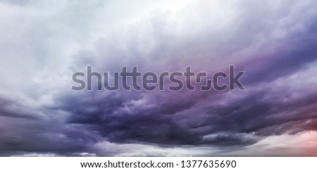 Dark storm clouds background. Dramatic dark cloudy sky