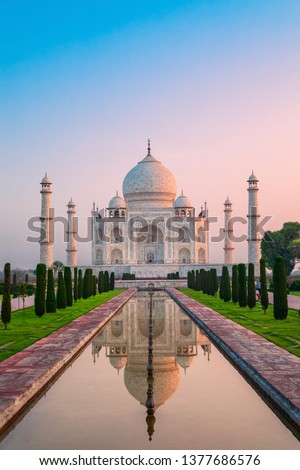 Taj Mahal is a white marble mausoleum on the bank of the Yamuna river in Agra city, Uttar Pradesh state, India Royalty-Free Stock Photo #1377686576