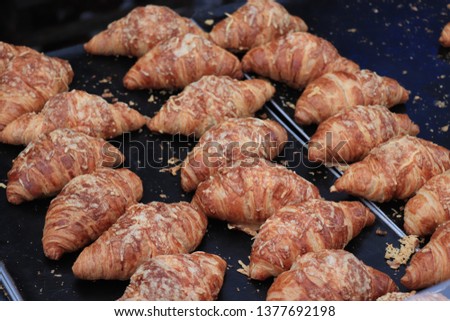 Fresh made croissants for sale at a market stall