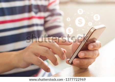 Close up image hand using mobile phone with online transaction application, Concept financial technology (fintech)