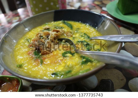Manado porridge menu served with a large bowl