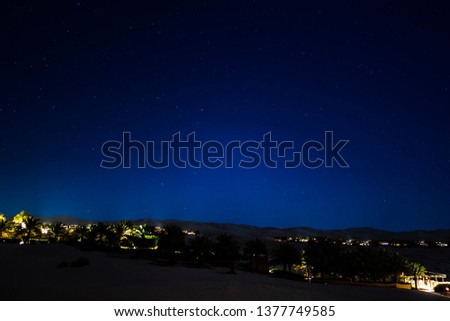 Desert night landscapes scene with camps under starry sky