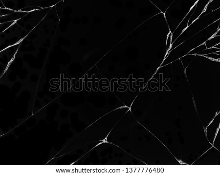 Cracked glass texture on black background. Isolated realistic cracked glass effect. Royalty-Free Stock Photo #1377776480