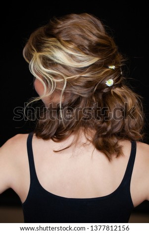 Female Long wavy brunette hair, rear view, indoor beauty salon