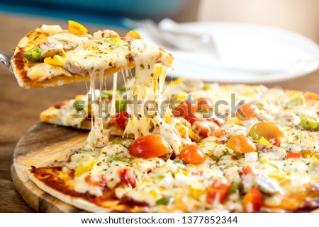 pepperoni pizza on wooden board