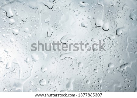 Picture Inside of water rain drops on car window glass 