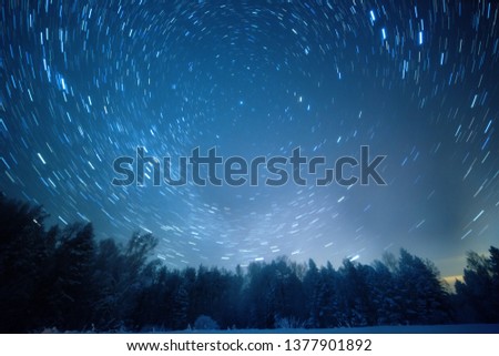 Starry sky revolves around the polar star. Leave traces in the form of lines. Winter, Russia