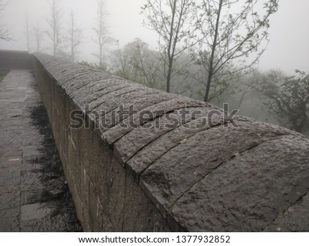 Perspective view of stone wall at fort in rain sessions