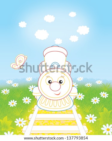 Friendly smiling toy train and small butterfly on a field with camomiles