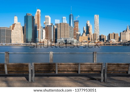 Scene of New york Cityscape river side with east river at the morning time under blue sky, USA downtown skyline, Architecture and building with tourist concept