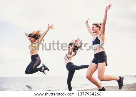 Happiness and joyful jump group of young female people in outdoor activity for healthy lifestyle together in friendship - success and team happy at the beach during summer vacation