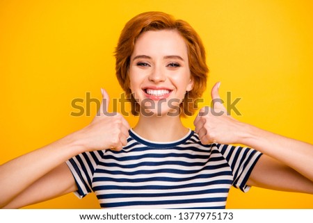 Close up photo beautiful amazing she her lady funky thumb up amazed advising buy buyer new product wearing casual striped white blue t-shirt outfit clothes isolated yellow bright vibrant background