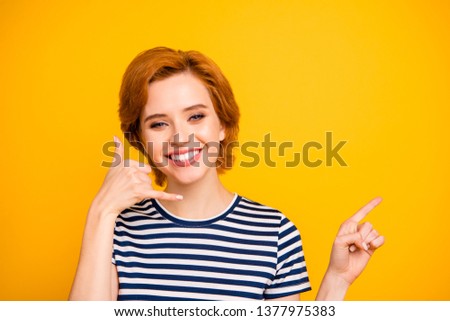 Close up photo beautiful foxy she her lady hand telephone symbol call center staff adviser agent manager tips empty space wear casual striped white t-shirt outfit clothes isolated yellow background