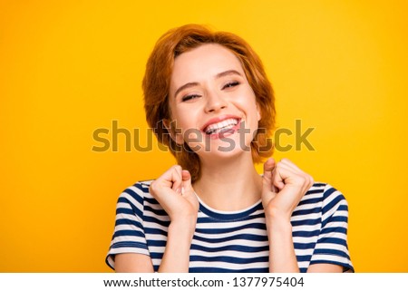 Close up photo beautiful amazing she her lady hand arm raised best win glad white teeth toothy wearing casual striped white blue t-shirt outfit clothes isolated yellow bright vivid background