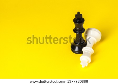 Chess figures on yellow background top view copy space Royalty-Free Stock Photo #1377980888