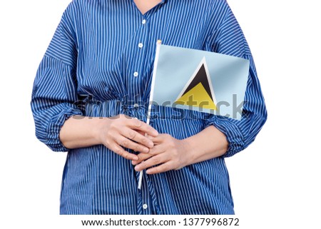 Saint Lucia flag. Close up of woman's hands holding a national flag of St Lucia isolated on white background.