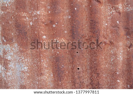 Vintage old brown zinc rusted and has weathered holes for the background.