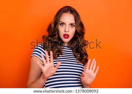 Close up photo beautiful she her lady red lipstick pomade ask stand still calm down pull over make pause off quit wear casual striped white blue t-shirt clothes isolated orange bright background
