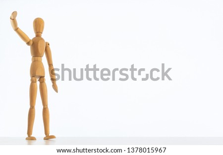 wooden little man isolated with white background. Free space for writing.