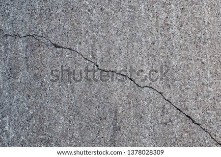 gray concrete wall with crack