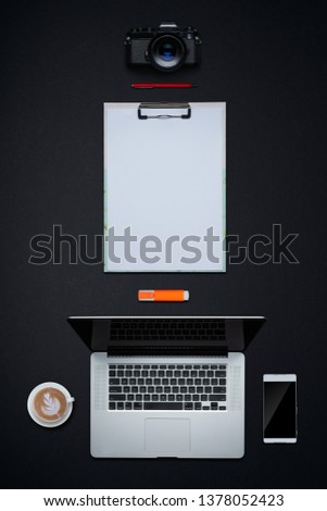 Office supplies with copy space on black background . Flat lay and top view business desk lifestyle concept. Vertical format .