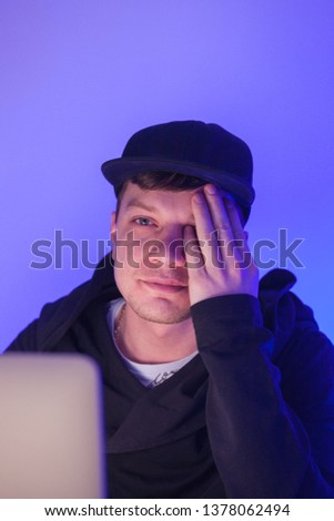 Closeup photo handsome man working on laptop