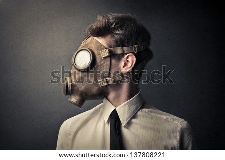 profile of young businessman with gas mask Royalty-Free Stock Photo #137808221