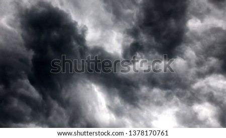 Dramatic Storm Clouds like dancing mystic figures in the sky before the rain