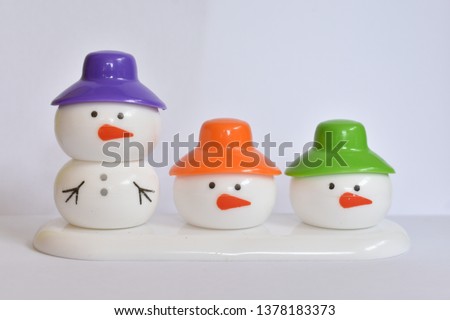 snowman toy with colourful caps