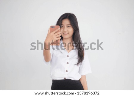 Portrait of thai adult student university uniform beautiful girl using her smart phone Selfie
