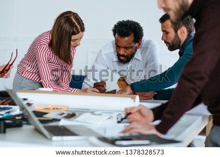 Group of business people working together in the modern office space.