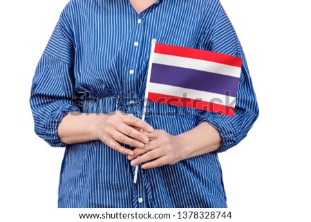 Thailand flag. Close up of woman's hands holding a national flag of Thailand isolated on white background.